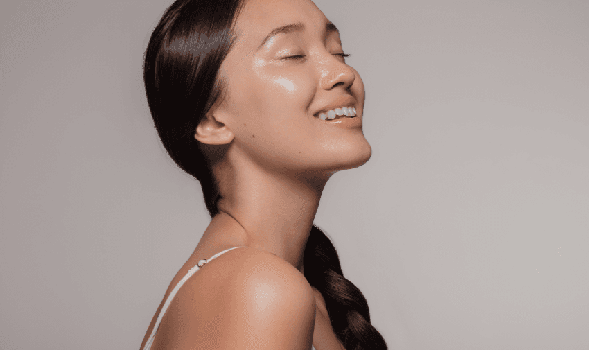 A smiling woman with radiant, glowing skin, representing Simply Sensitivity Checks' dedication to personalised wellness. Highlighting Purpl's exclusive disabled discounts, making health and allergy testing more accessible for disabled individuals in the UK.