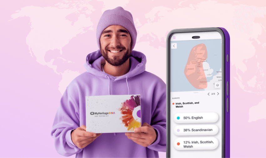 A smiling person in a purple hoodie and beanie holds a MyHeritage DNA kit. Next to them is a smartphone displaying DNA ancestry results, including percentages of English, Scandinavian, and Irish/Scottish/Welsh heritage. A world map is in the background.