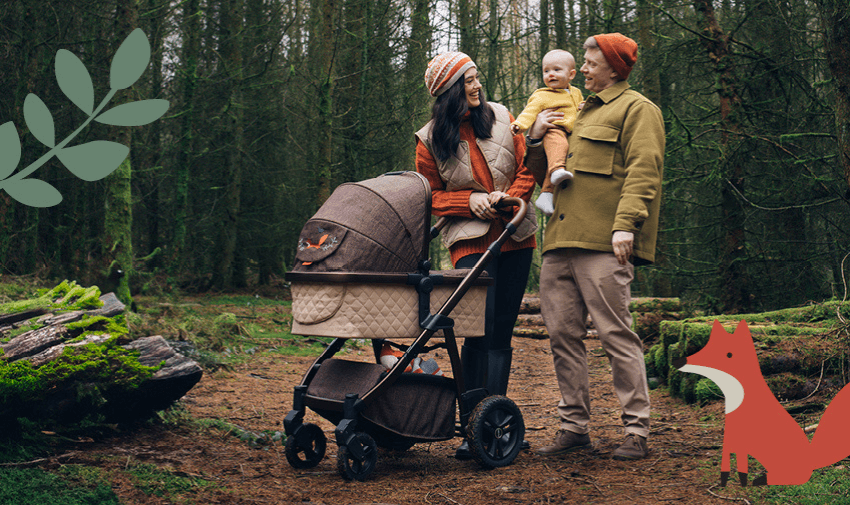 A family enjoys a woodland walk with their baby, showcasing a stylish and practical Cosatto pushchair in a nature-inspired design. Perfect for Purpl members seeking quality baby gear for outdoor adventures.