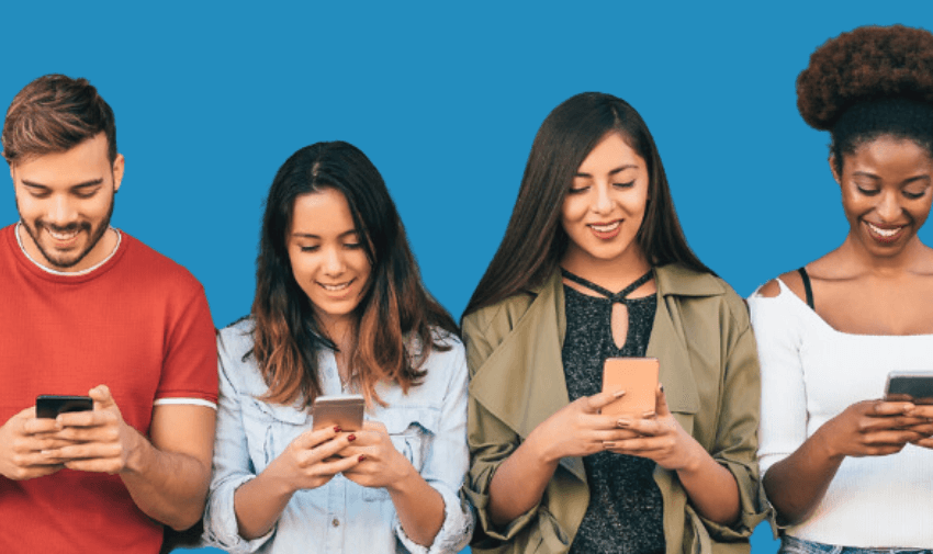 group of four adults staring at their mobile phone screens with a blue background