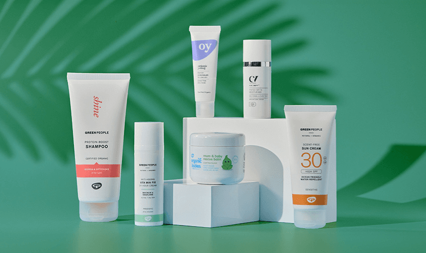 A collection of Green People organic skincare products, including sun cream, shampoo, and baby care, displayed on a green background. Highlighting Purpl's disabled discounts for natural and sustainable beauty products in the UK.