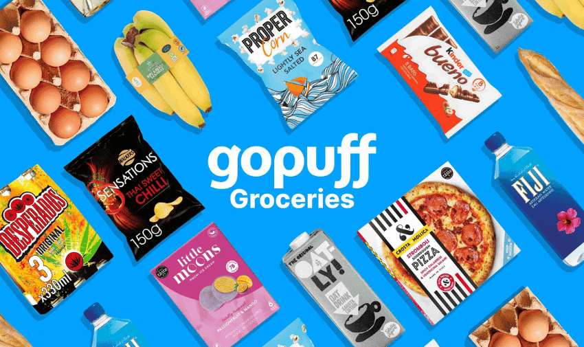 A collage of grocery items against a blue background includes eggs, bananas, Proper Corn, Sensations crisps, a pizza, a bottle of mineral water, a baguette and other food products. The centre text reads "GoPuff Groceries”.