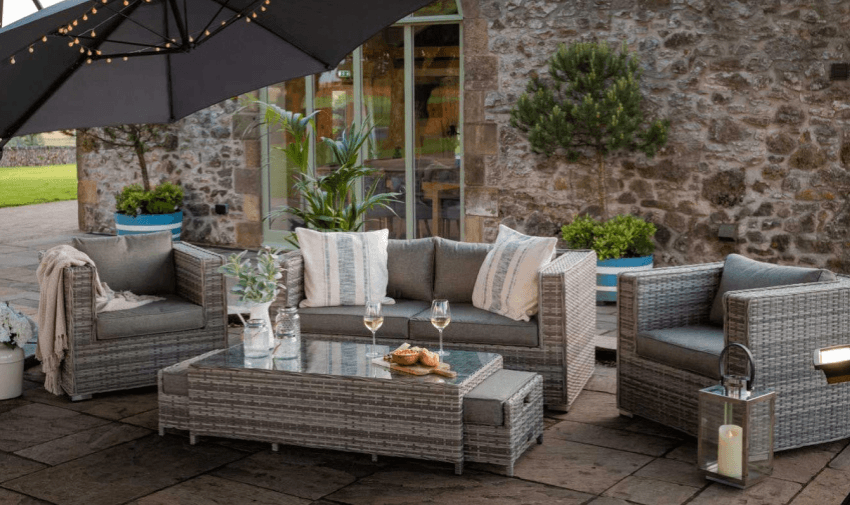 a garden sofa and arm chair rattan collection with a matching table