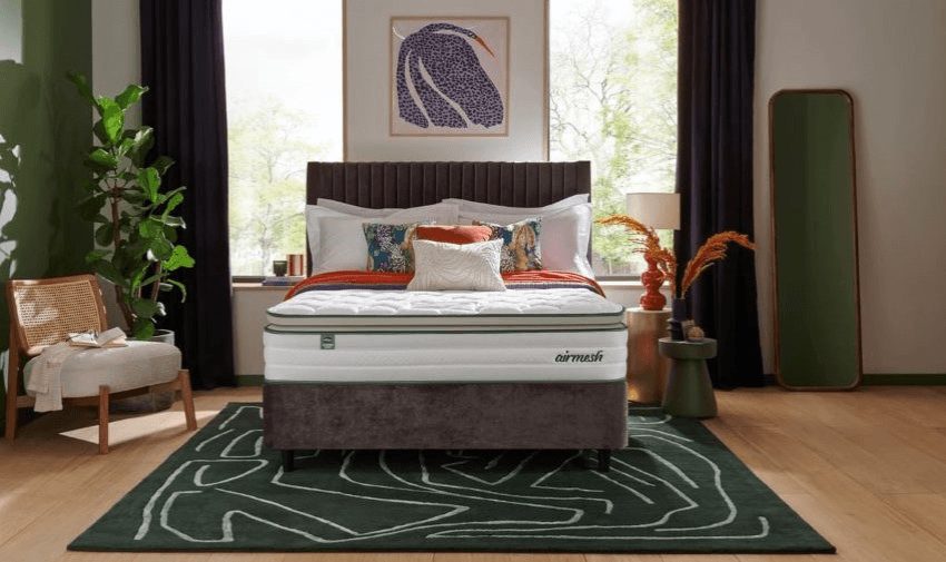 A luxurious Silentnight mattress displayed in a modern, stylish bedroom with elegant decor, showcasing comfort and support. Disabled shopping discounts available.