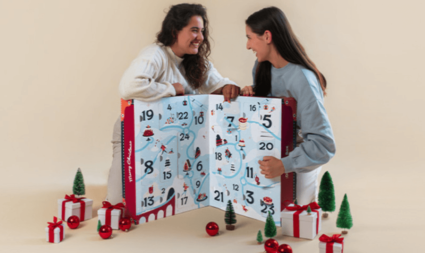 Degusta Box Advent Calendar with two people looking at it