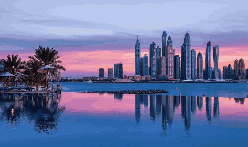 A stunning skyline view at sunset, with an infinity pool and palm trees, showcasing Radisson's premium travel destinations. Promoting Purpl's exclusive offers and disabled travel discounts, making luxury travel accessible for all.