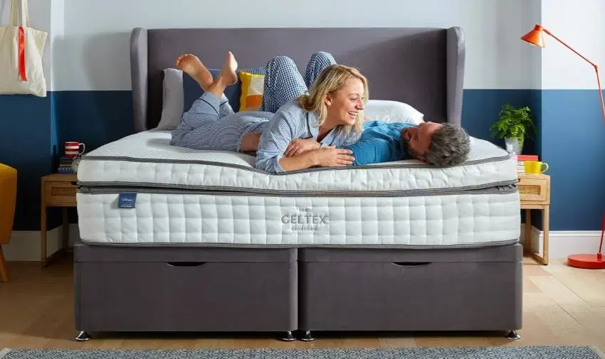 A couple enjoying a comfortable Silentnight mattress, highlighting relaxation and premium sleep quality. Mobility discounts and offers available.