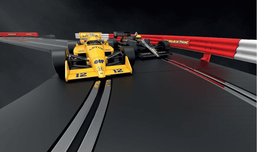 Two toy slot cars racing on track