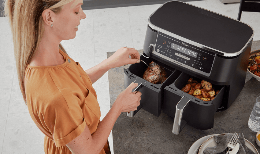 A lady using her Ninja dual airfryer