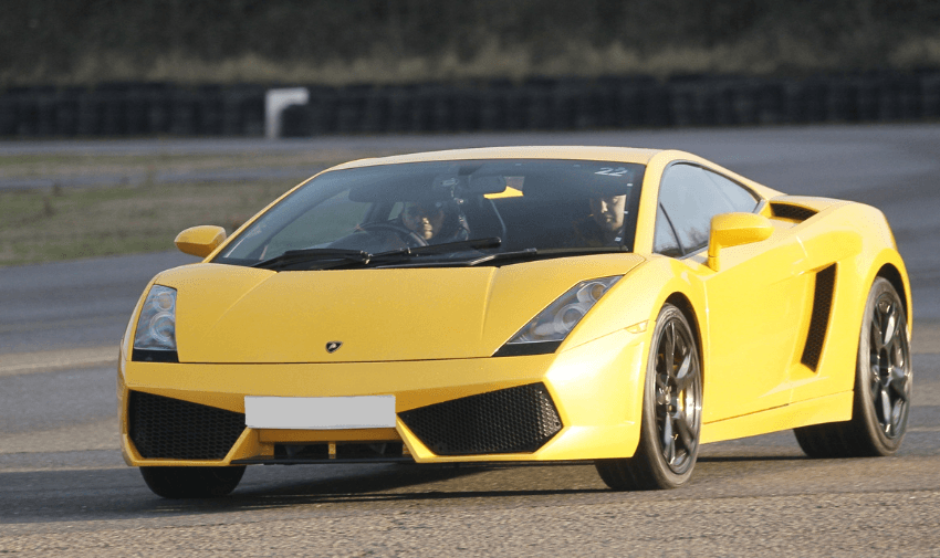 A yellow super sportscar on the track