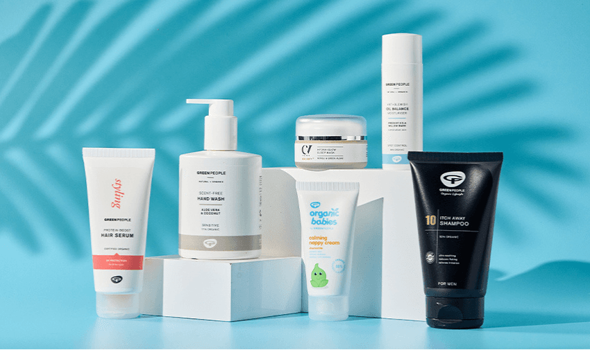 "A collection of Green People organic skincare products, including sun cream, shampoo, and baby care, displayed on a green background. Highlighting Purpl's disabled discounts for natural and sustainable beauty products in the UK."