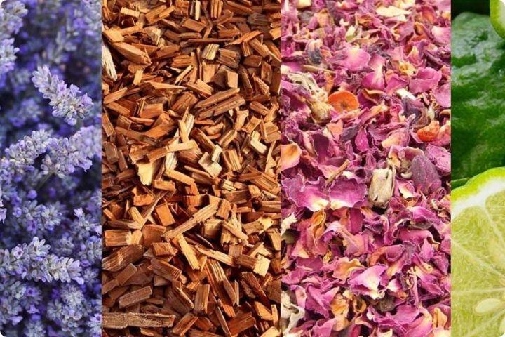 A variety of dried flowers and fruits, lavender flowers, cinnamon bark, rose petals and limes