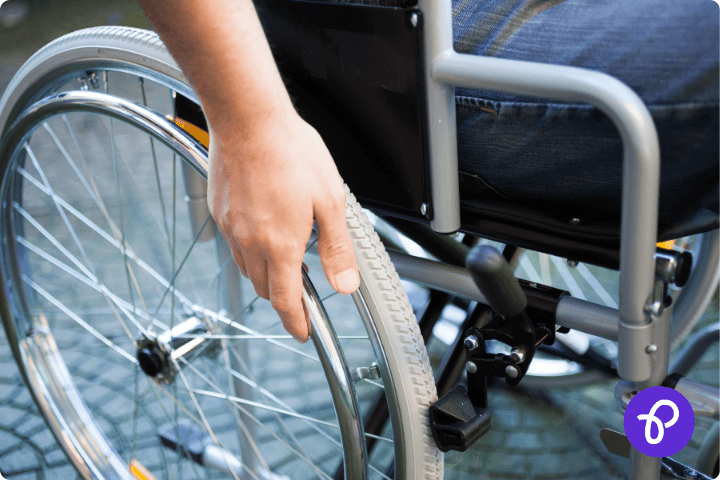 wheelchair user close up and hand for a blog about the get Britain working white paper and how it affects disabled people