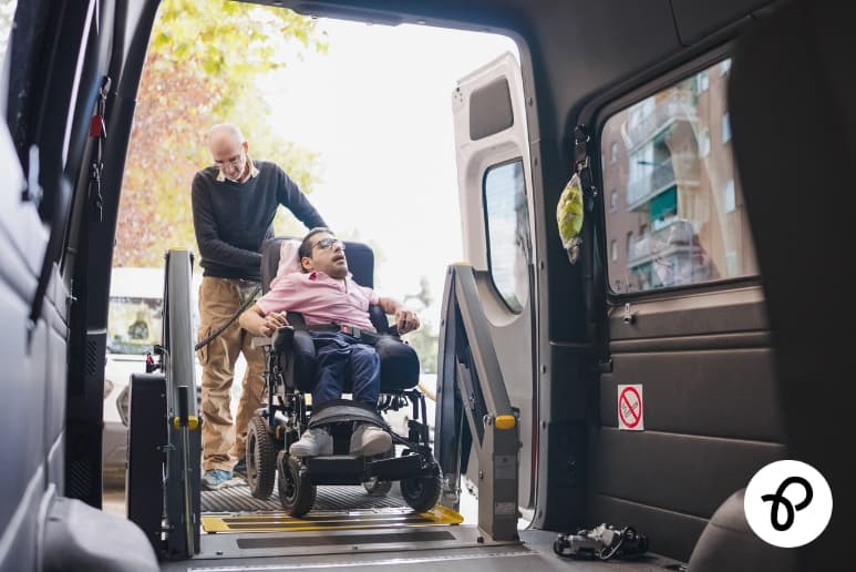 Wheelchair user entering adapted Motability vehicle showing disability mobility support and rising costs impact in the UK.