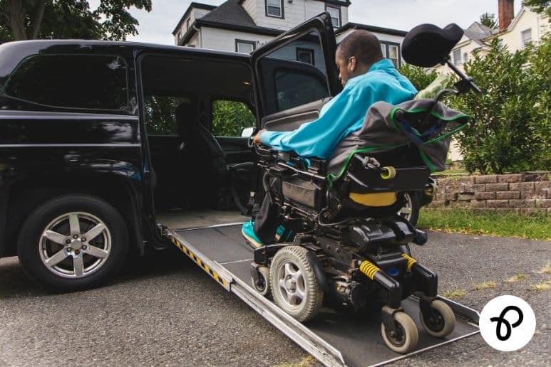 Scottish wheelchair user entering accessible vehicle through ramp as part of AVE scheme mobility car application with Purpl discounts.