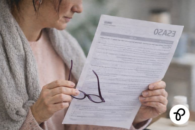 Woman with long term health condition reviewing ESA50 form after SSP ends UK disability benefits support.